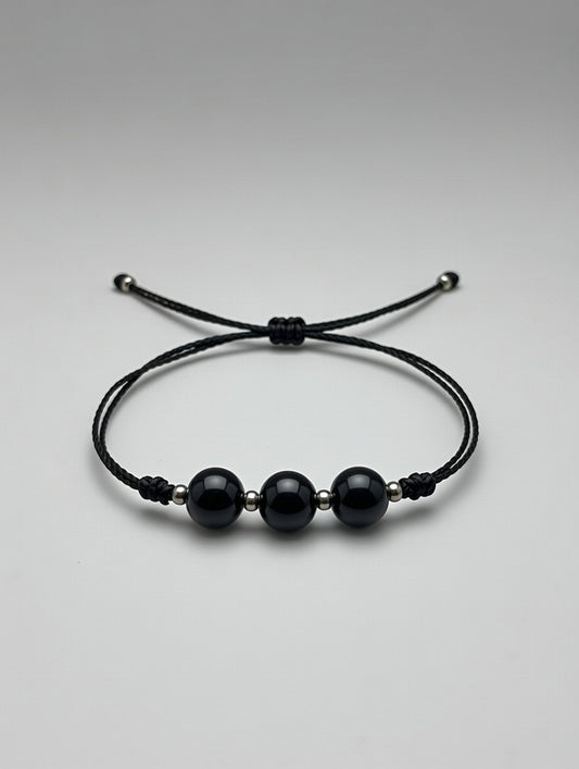 Ónice en Pulsera de (hilo negro) - Santa Hildegarda