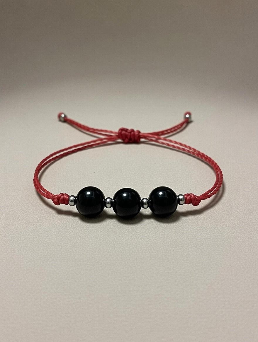 Ónice en Pulsera (hilo rojo) - Santa Hildegarda